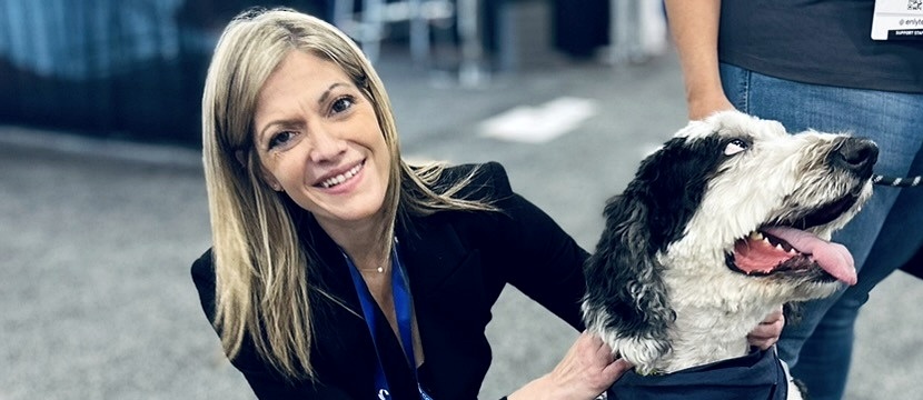 Alexandra Eve Maimonis at a legal conference with a service dog.